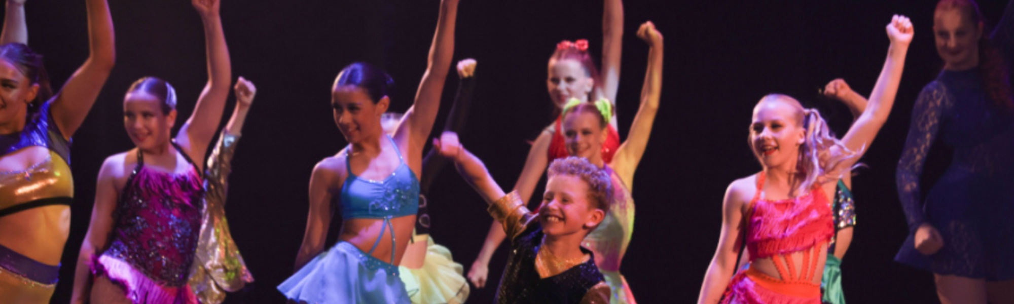 Young performers on stage at a Baycourt dance performance.